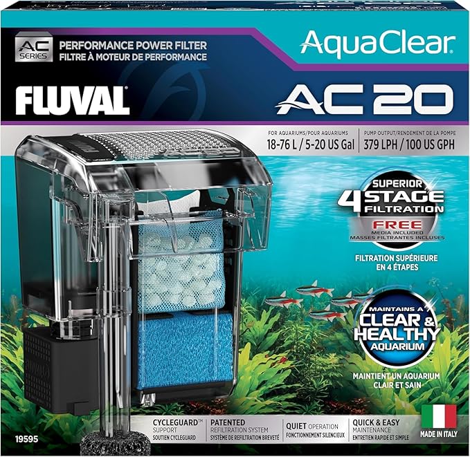 A quality betta staple food pellet container beside a planted aquarium